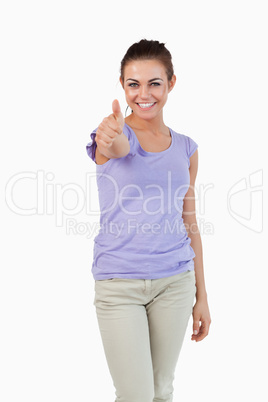 Smiling young female giving thumb up Smiling young female giving thumb up