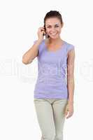 Smiling young female on the phone