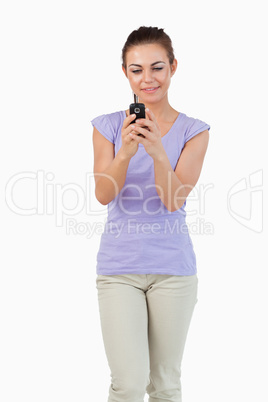 Young female typing text message