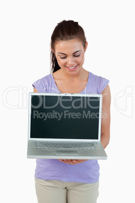 Young female looking at her laptop