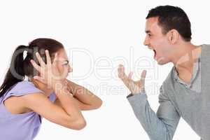 Young couple shouting at each other