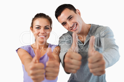 Young couple giving approval