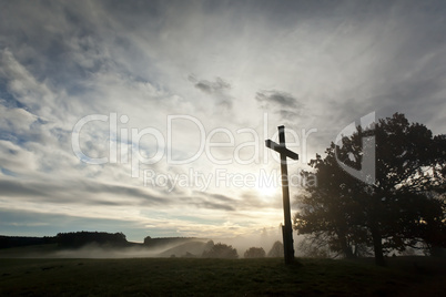 dramatic sky and a cross