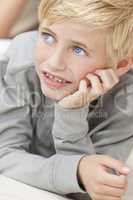 Blond Hair Blue Eyes Boy Child Resting on His Hands