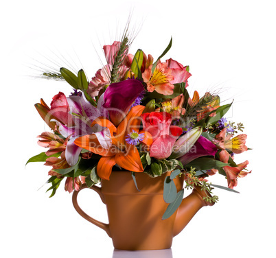 Bouquet of flowers in watering can