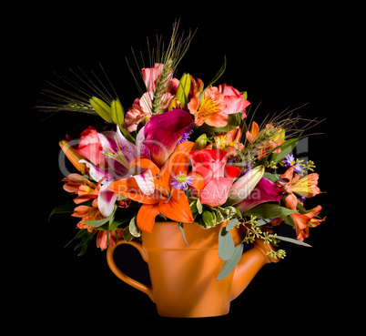 Bouquet of flowers in watering can
