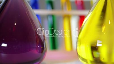 bright colored liquids in lab flasks