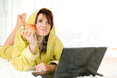 woman with laptop and apple