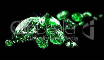 Emeralds on black surface