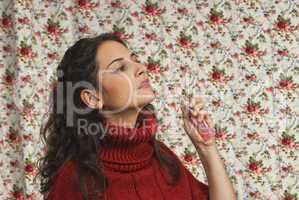 Woman with parfume with colorful floral background