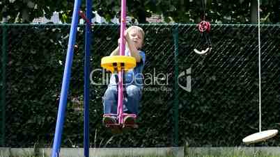 Little boy on swing