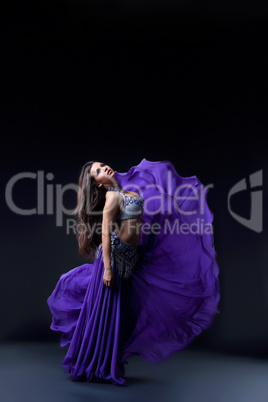 arabia dancer posing with flying fabric