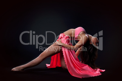 beautiful young dancer in traditional rose costume