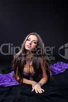 beauty arabia dancer lay on purple veil
