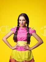 Funny girl in doll costume look serious