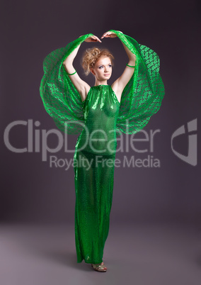 Naked woman in green transparent dance costume
