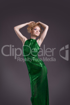 Amazing woman posing in transparent green costume