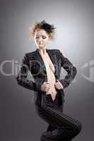 Young beauty woman with nude breast in retro suit