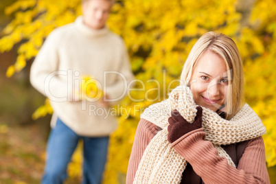 Autumn happy woman with man in park