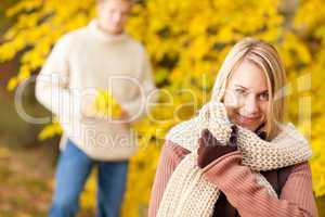 Autumn happy woman with man in park