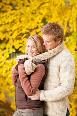 Autumn romantic couple happy hugging in park