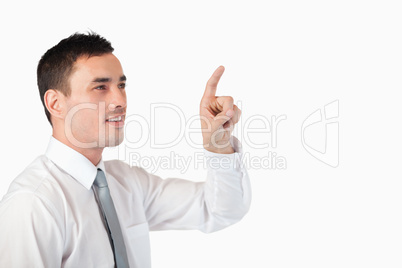 Businessman pointing at invisible screen