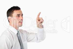 Businessman pointing at invisible screen