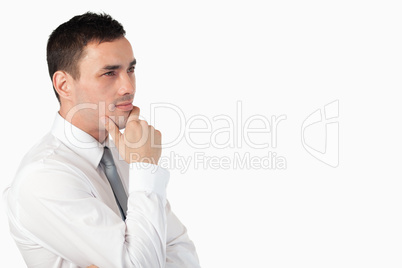 Thoughtful businessman posing