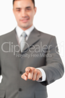 Portrait of a businessman pressing an invisible key