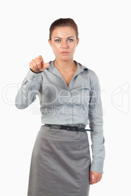 Portrait of a gorgeous businesswoman pressing an invisible key