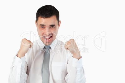 Handsome businessman with the fists up