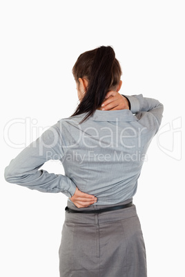 Portrait of the painful back of a businesswoman