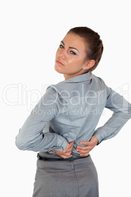 Portrait of a tired businesswoman having back pain