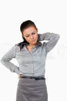 Portrait of a depressed businesswoman having back pain