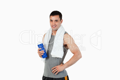 Young male with a bottle after training