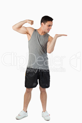 Young male about to punch what he is presenting