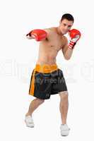 Young boxer performing a right hook