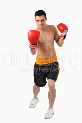 Young boxer performing uppercut