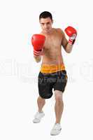 Young boxer performing uppercut