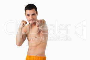Young martial arts fighter attacking