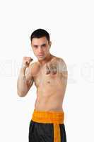 Young martial arts fighter with bare fists