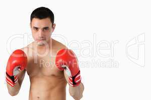Confident young boxer in fighting stance