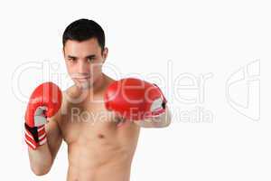 Young boxer performing left punch