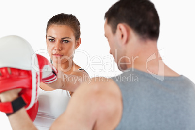 Young female with her martial arts trainer