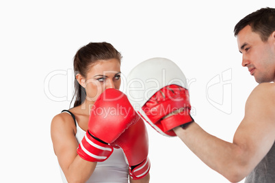 Female boxer listening to her trainer