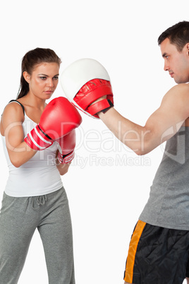 Young female practicing boxing