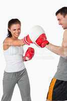 Aggressive female boxer striking her target