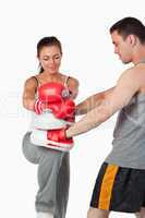 Female martial arts fighter practicing her knee technique