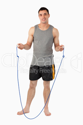 Young sportsman preparing for jump roping