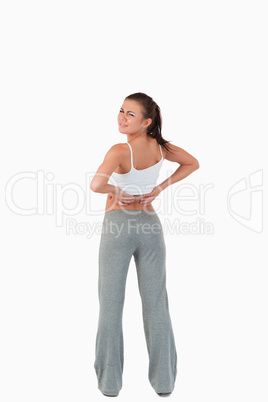 Back view of woman with back pain
